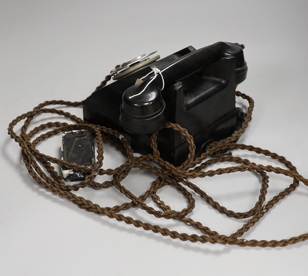 A black Bakelite telephone handset